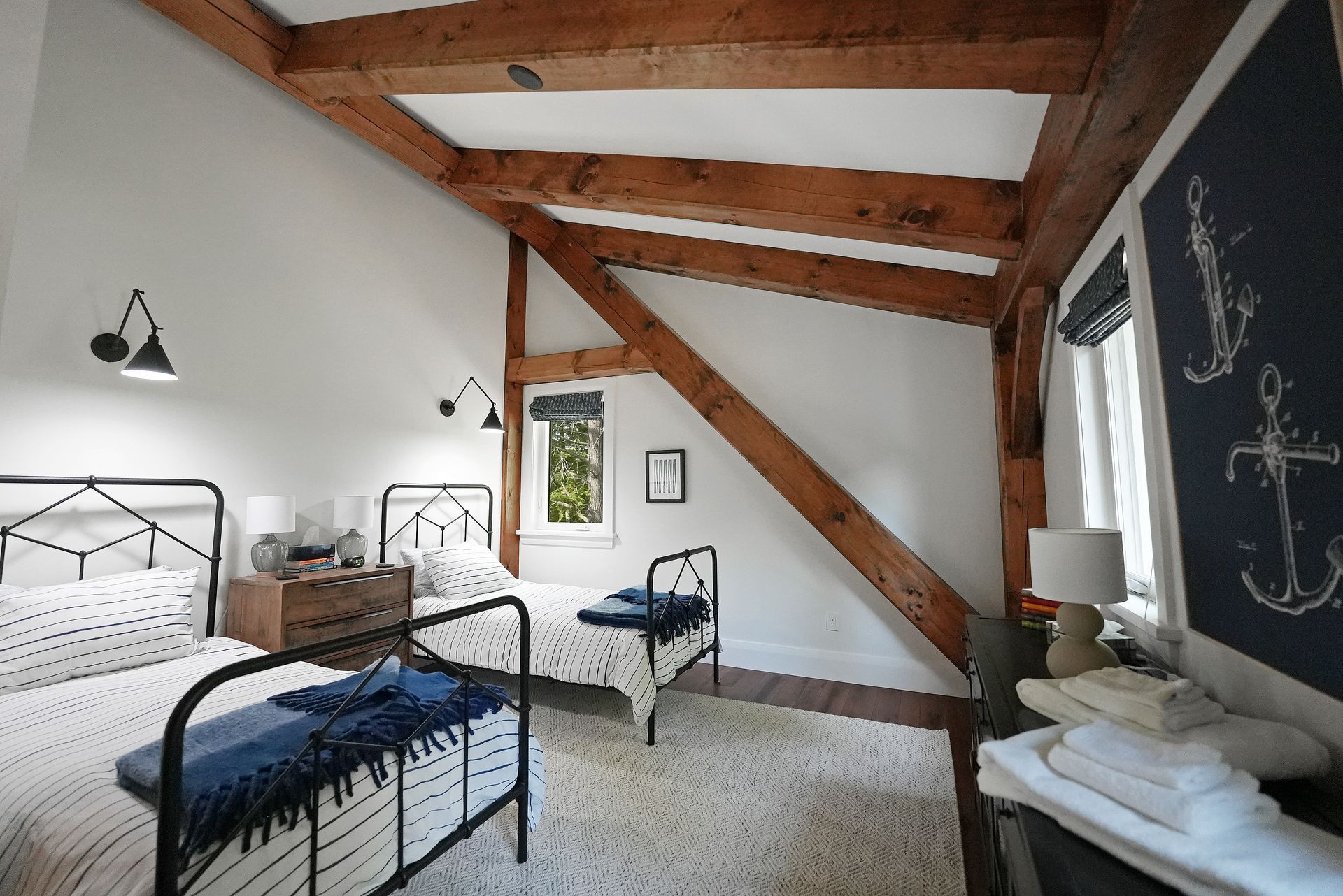 A bedroom with a bunk bed and a bed.