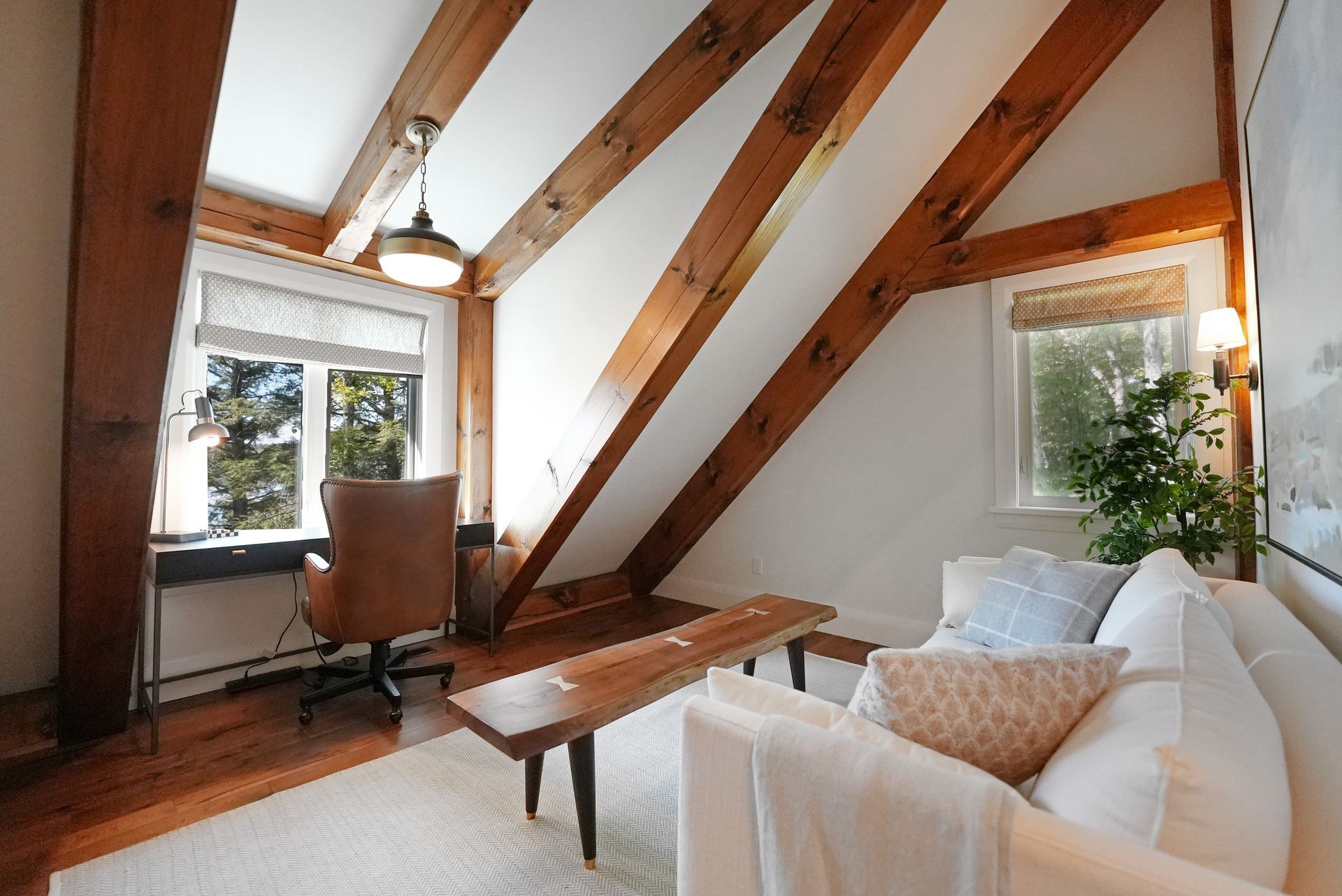 A living room with a wooden table and chairs