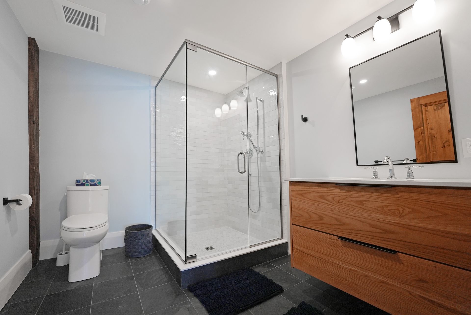 A bathroom with a lantern hanging from the ceiling