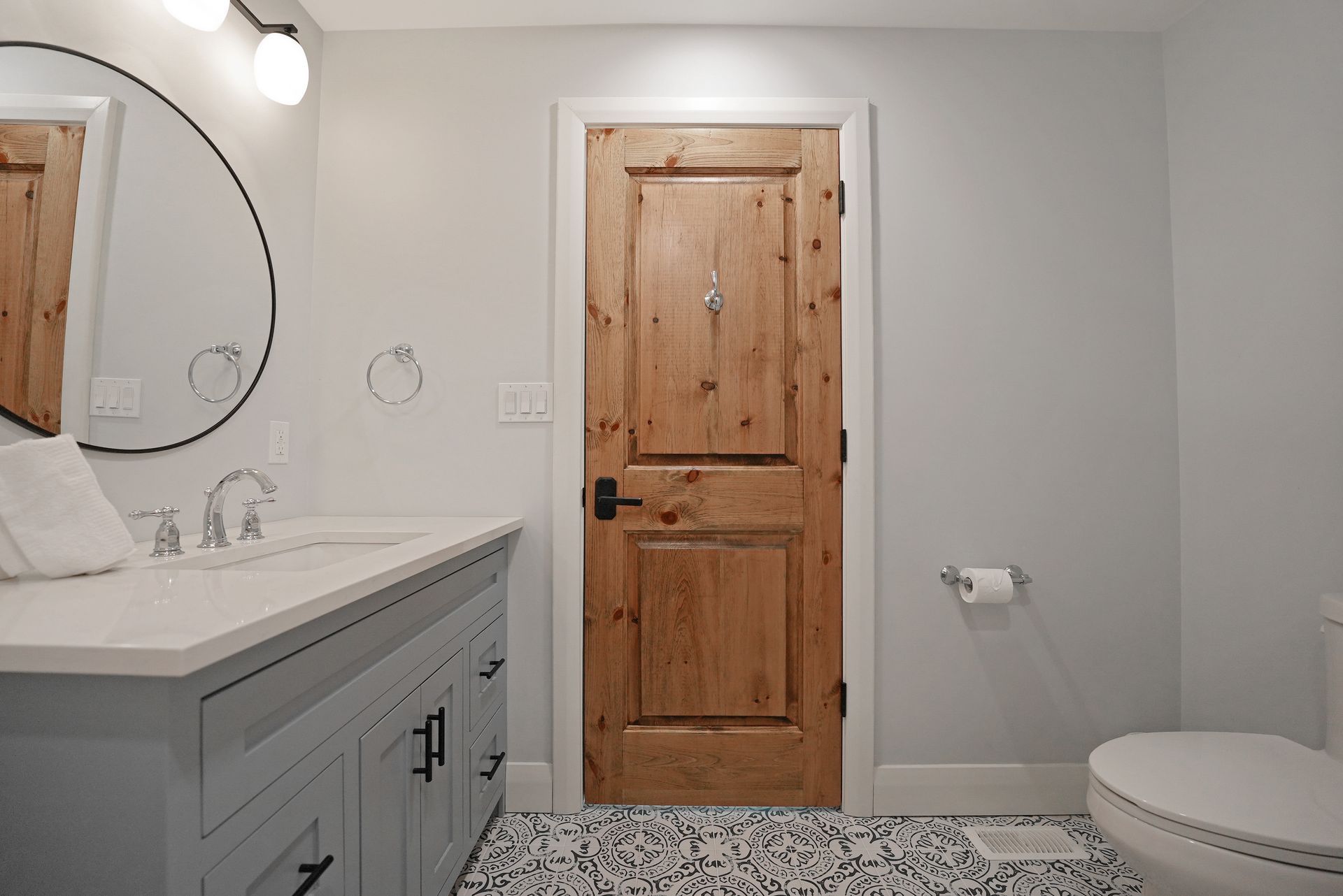 A bathroom with a lantern hanging from the ceiling