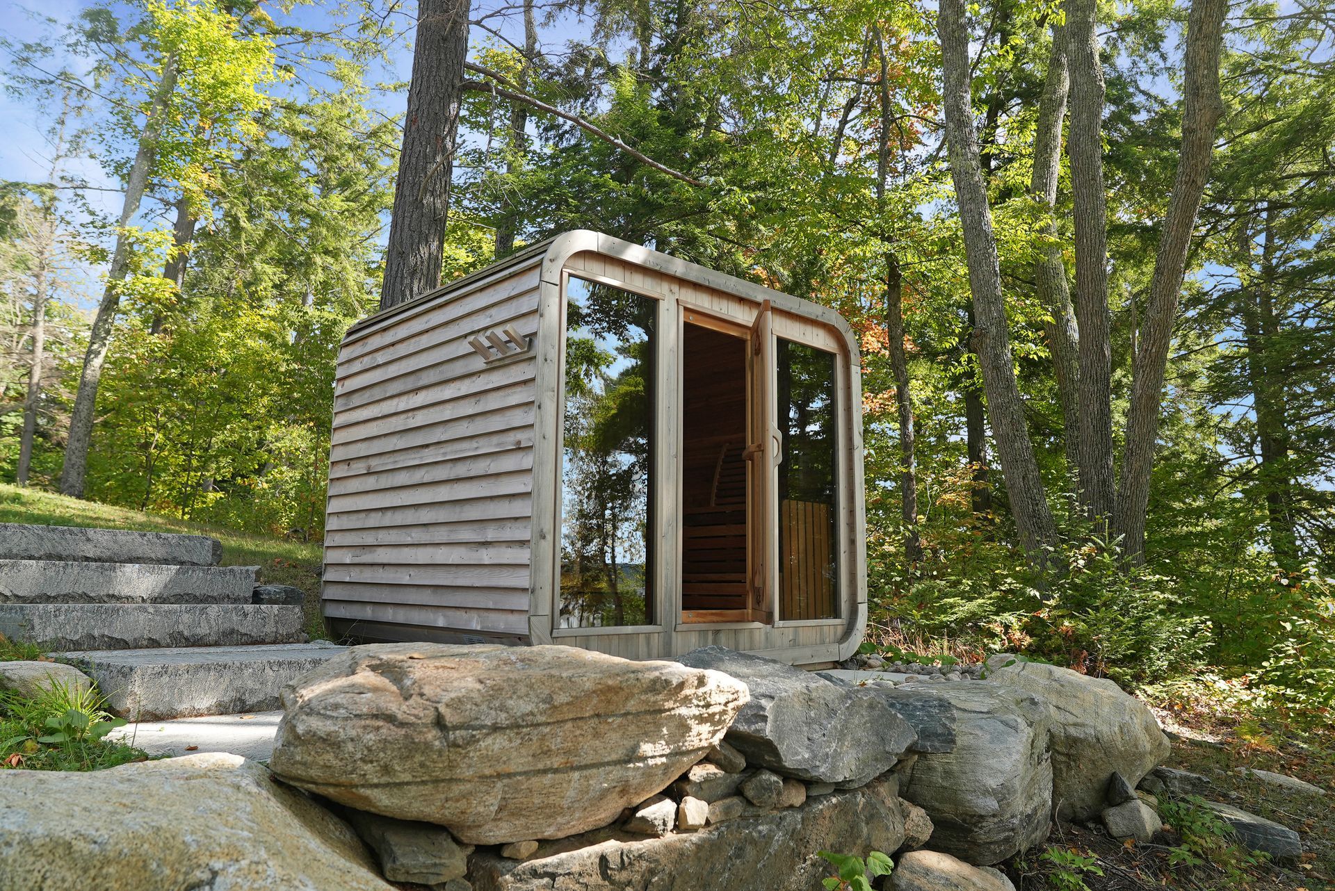 A boat is docked at a dock on a lake