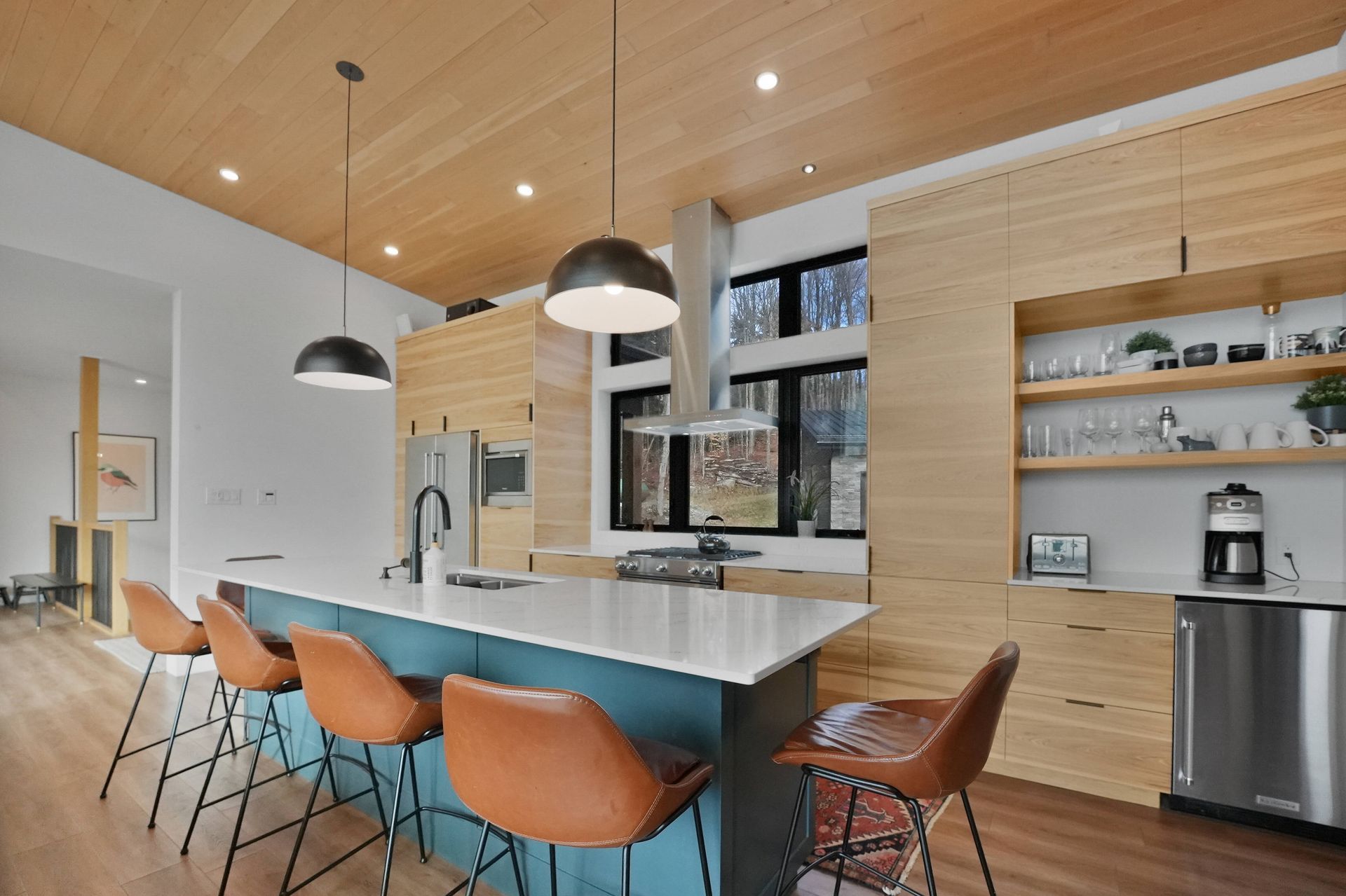A living room with a fireplace and lots of windows