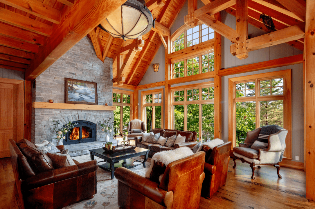 A living room with a fireplace and lots of windows