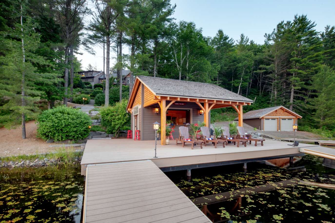 A dock leading to a house in the woods