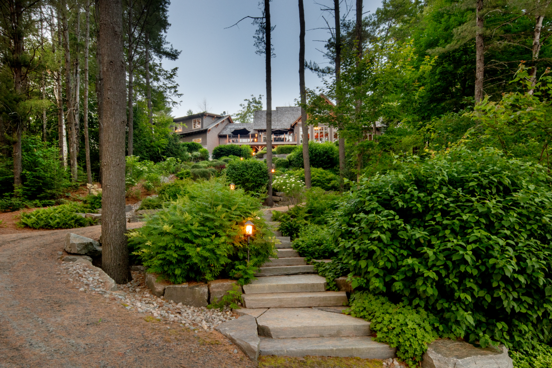A staircase leading up to a house in the woods