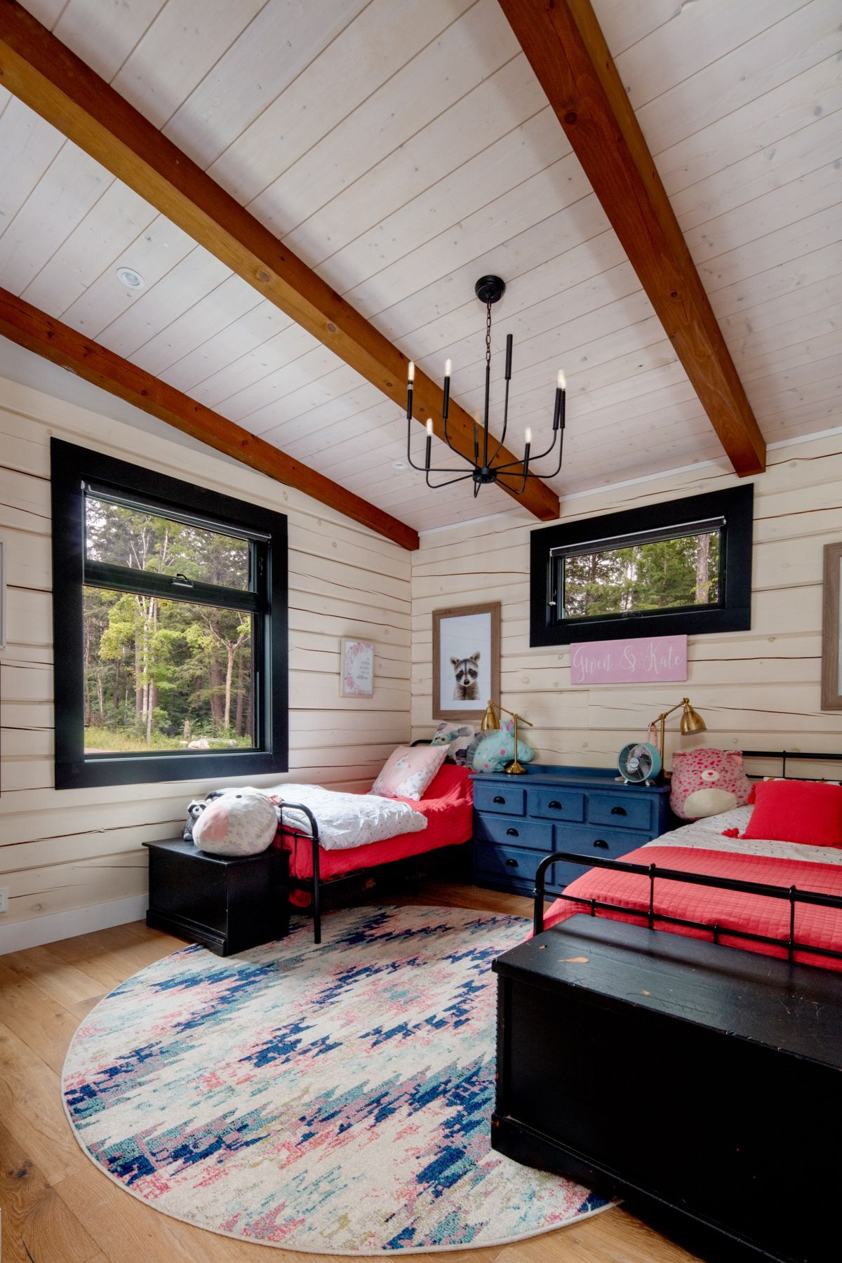 A bedroom with a bunk bed and a bed.