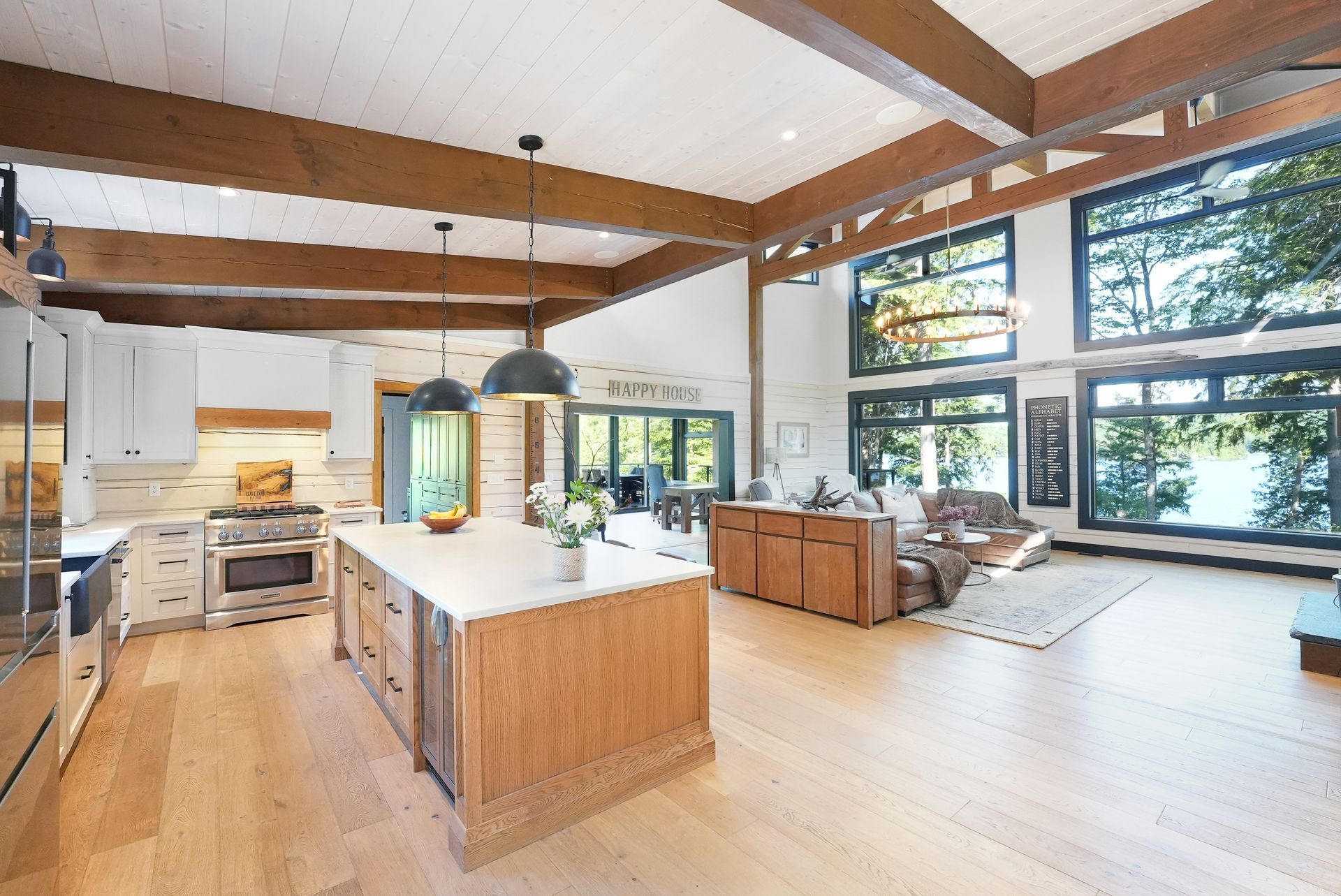 A living room with a couch and lots of windows.
