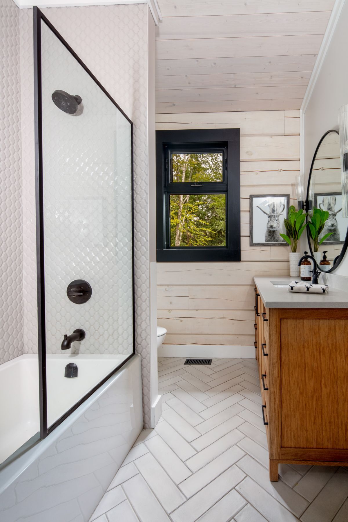 A bathroom with a sink , toilet , and sauna.
