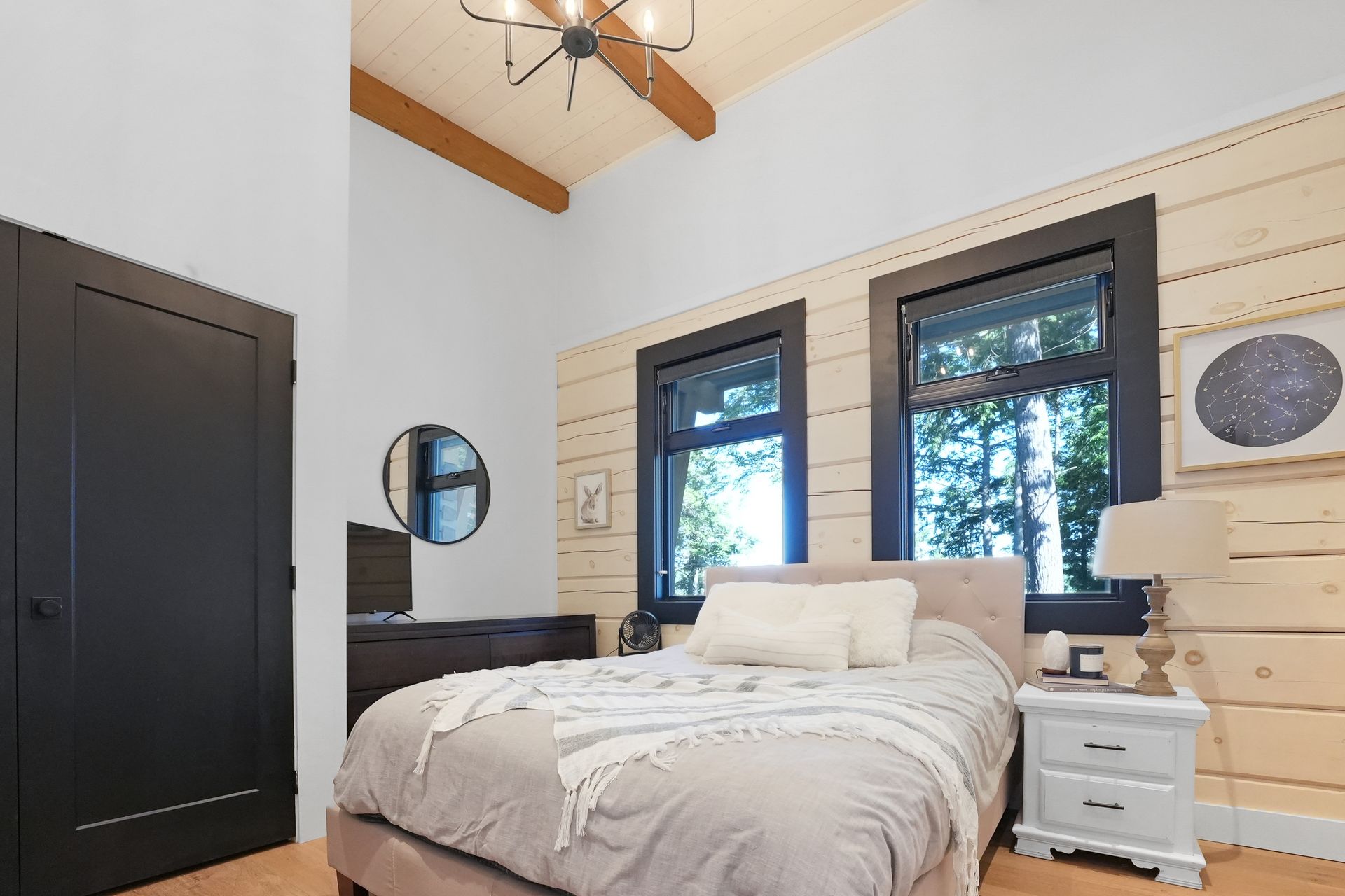 A bedroom with a bunk bed and a bed.