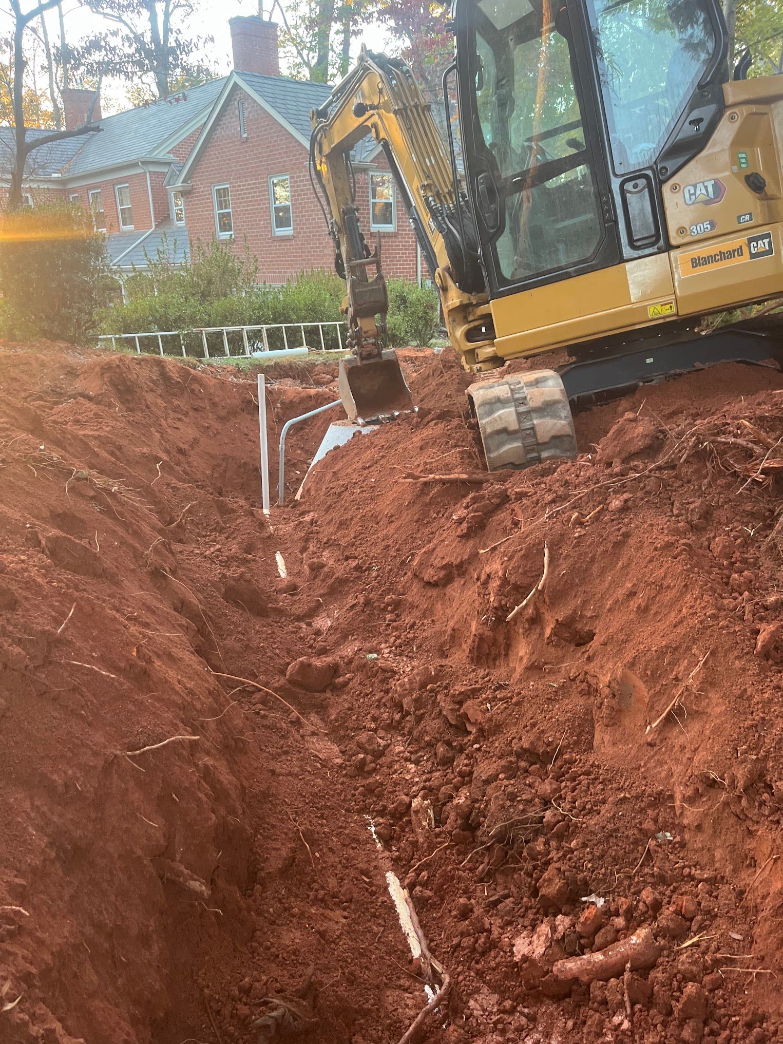 A bulldozer is digging a hole in the dirt.