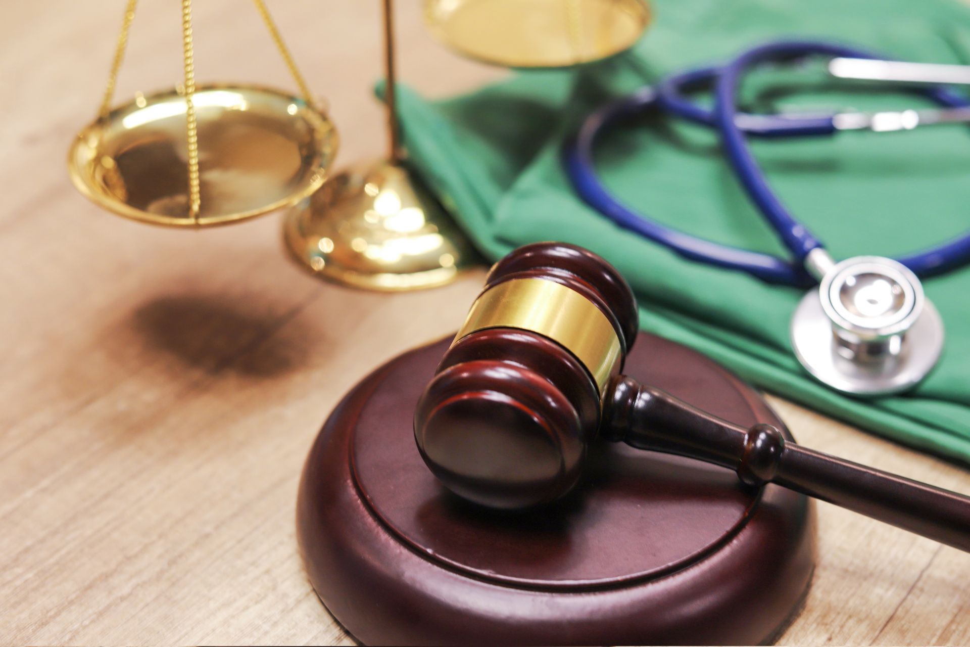 Medical law concept,Gavel and stethoscope in background.