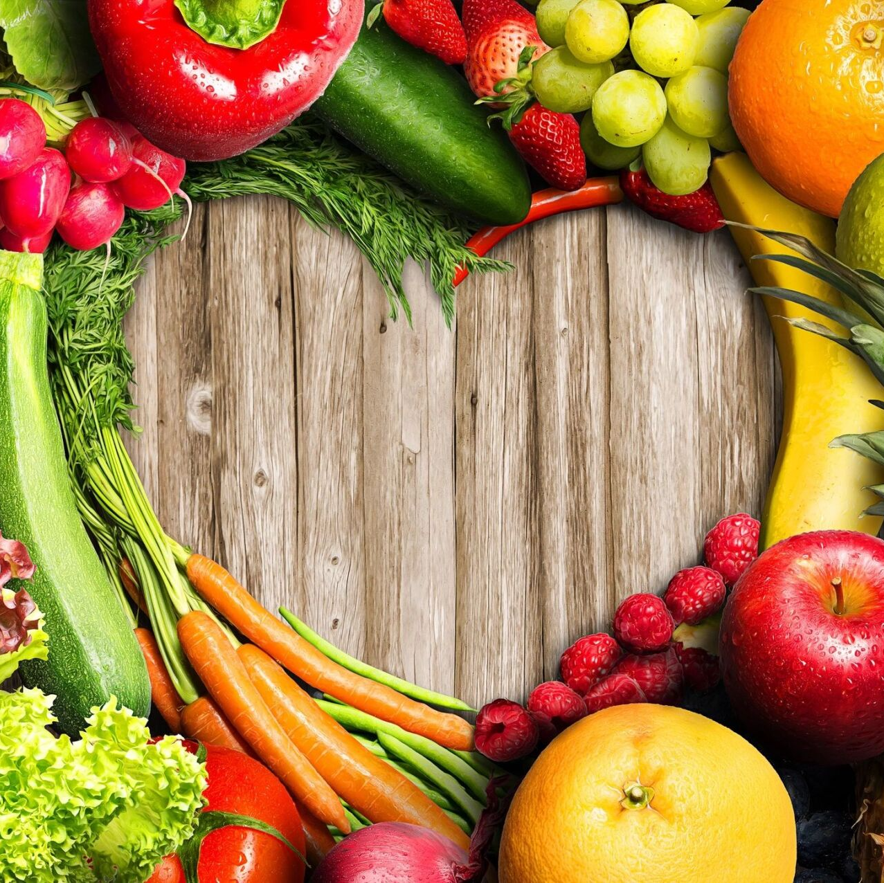 A variety of fruits and vegetables on a wooden table