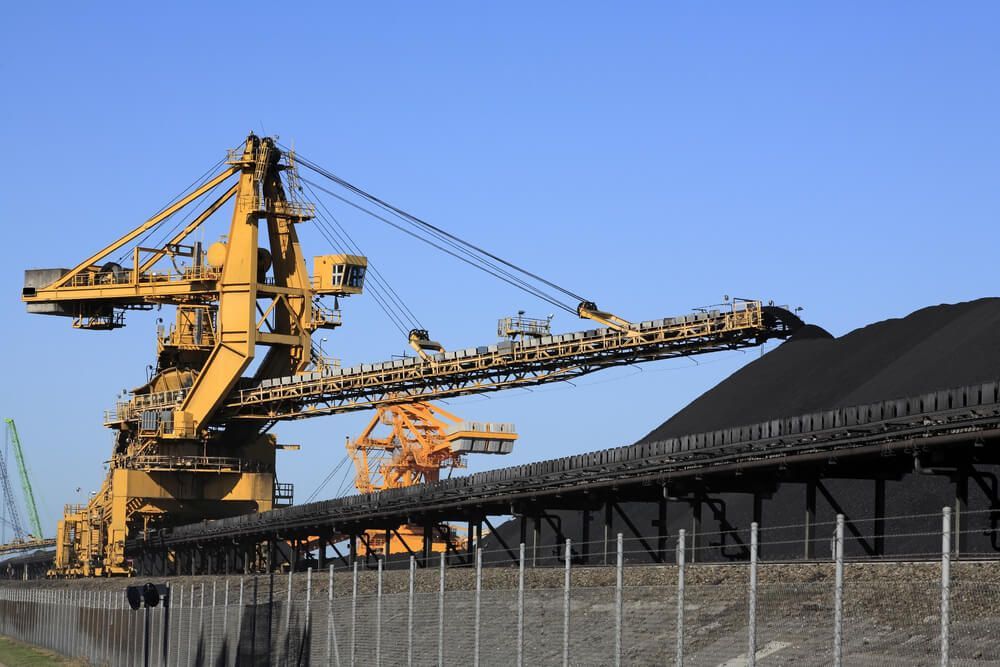 Huge coal loading conveyor belt piles coal — Financial Planner in Queensland