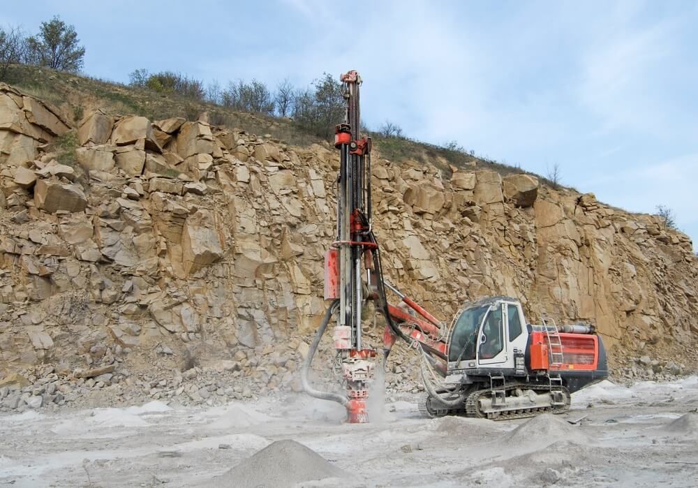 Drilling Machine in Open Cast Mining Quarry — Financial Advisors in Queensland