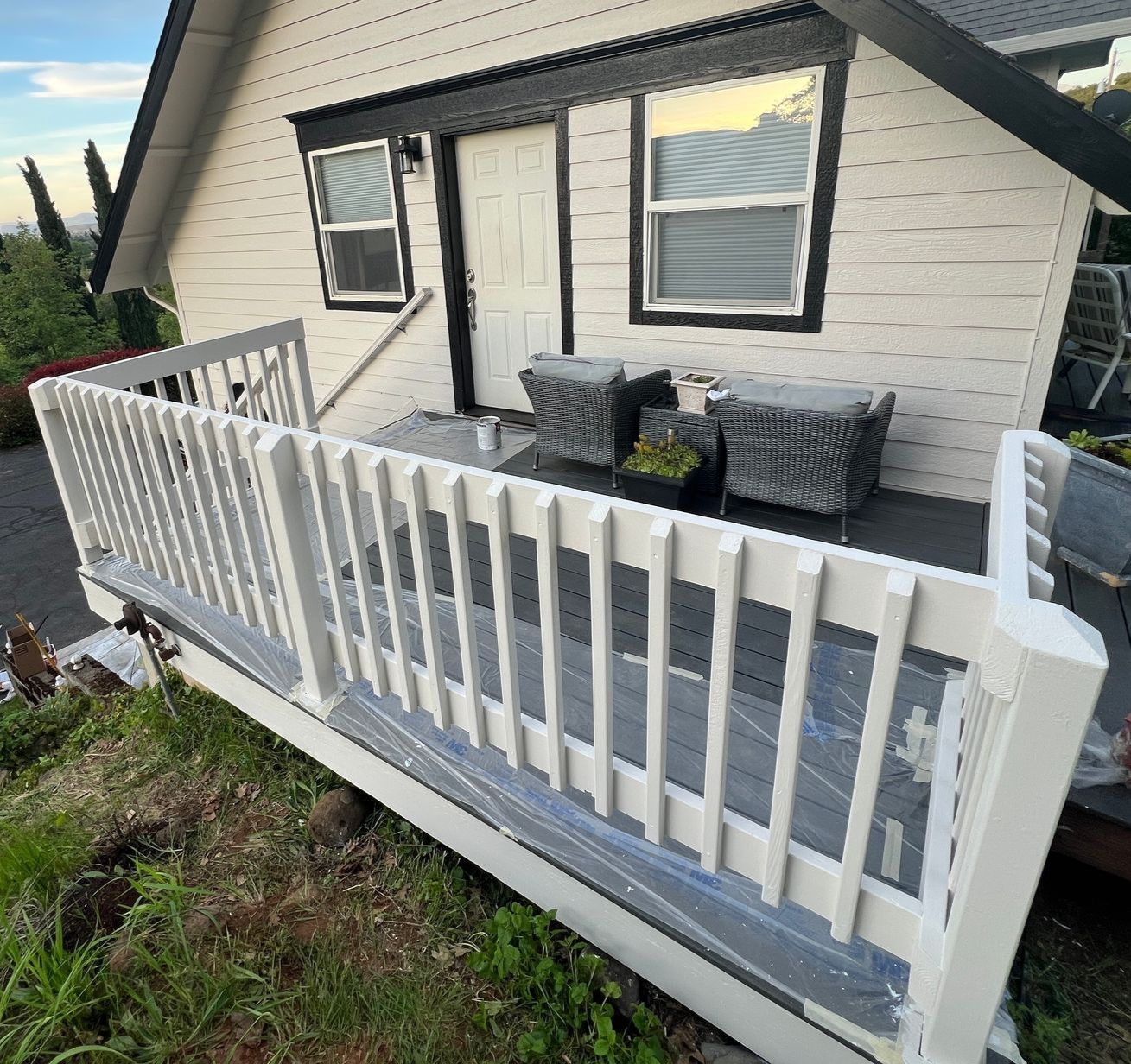 A wooden deck railing with new paint on a home in Medford, Oregon. 