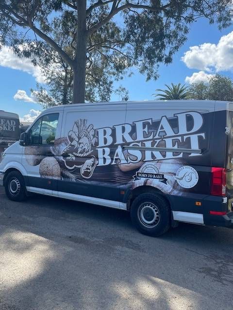 A bread basket van is parked under a tree — Bread Basket in Kurri Kurri, NSW 