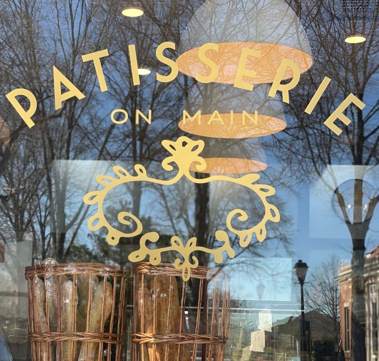 a bunch of bread in the shape of animals are sitting on a shelf .