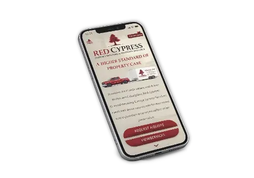 A smartphone displaying a Red Cypress Property Care website on its screen against a white background.