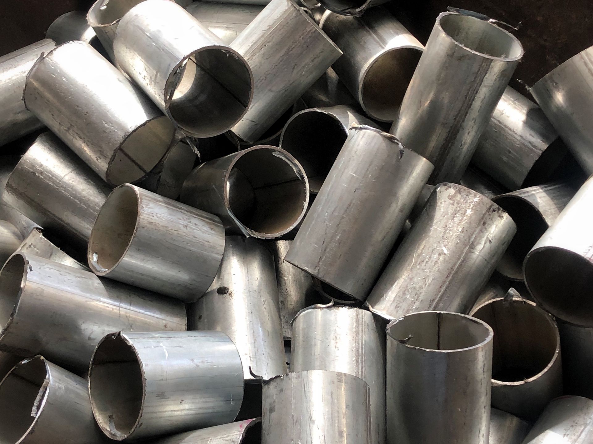 Used pipeline stacked in junkyard, prepare for recycle | Bristol TN.