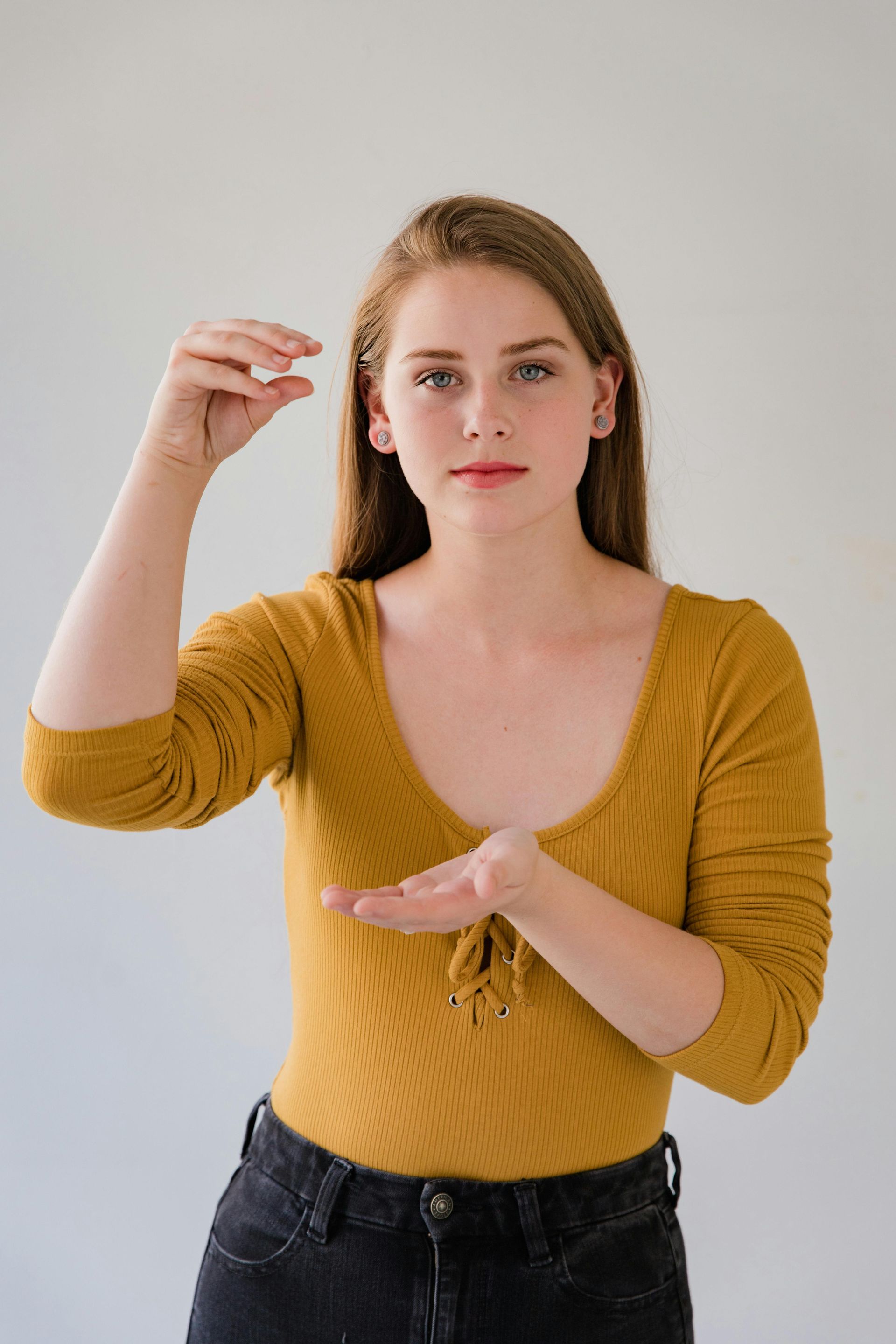Woman using hand gestures, representing inclusive communication and website accessibility