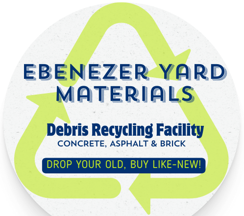 There is a large pile of rocks in the middle of a dirt field.