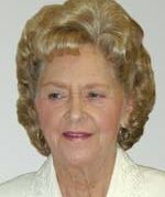 A black and white photo of an elderly woman wearing glasses.