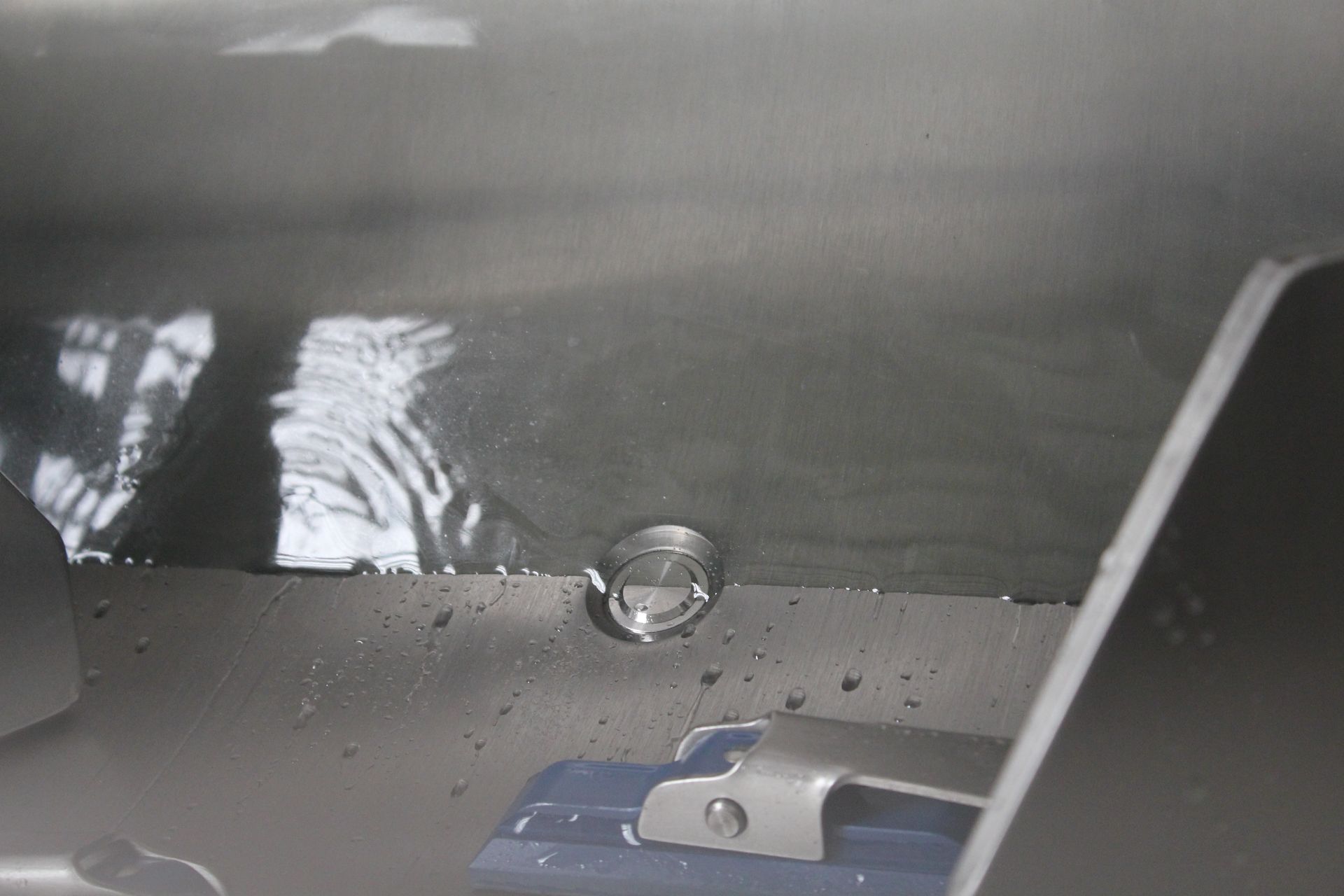 A close up of a metal object with a hole in it.