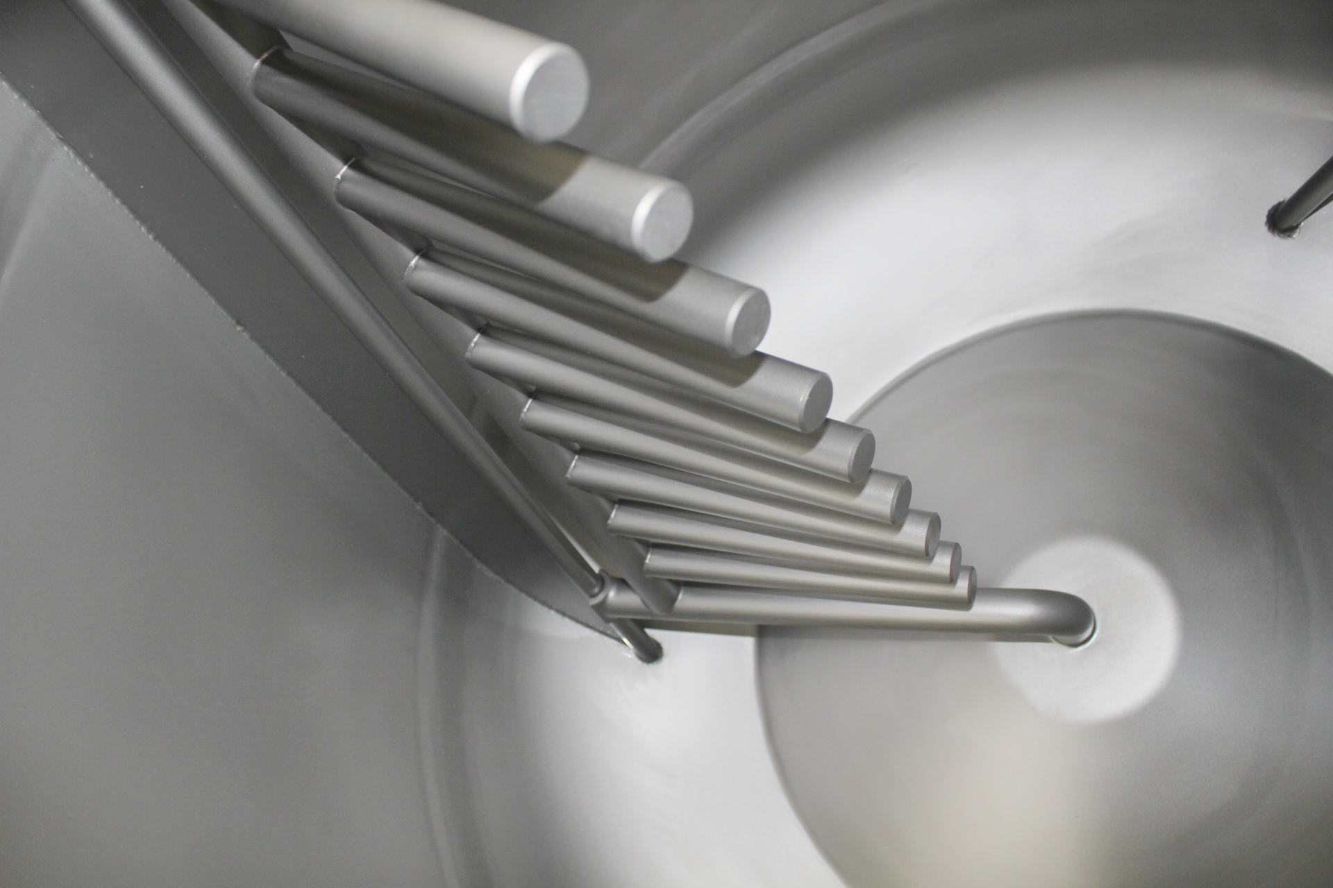 A close up of a metal object in a machine.