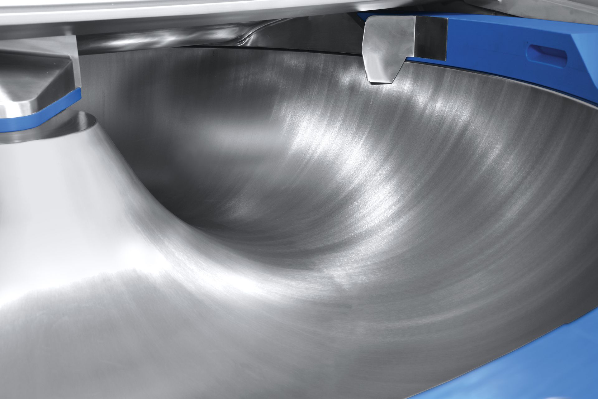 A close up of a stainless steel bowl on a table.