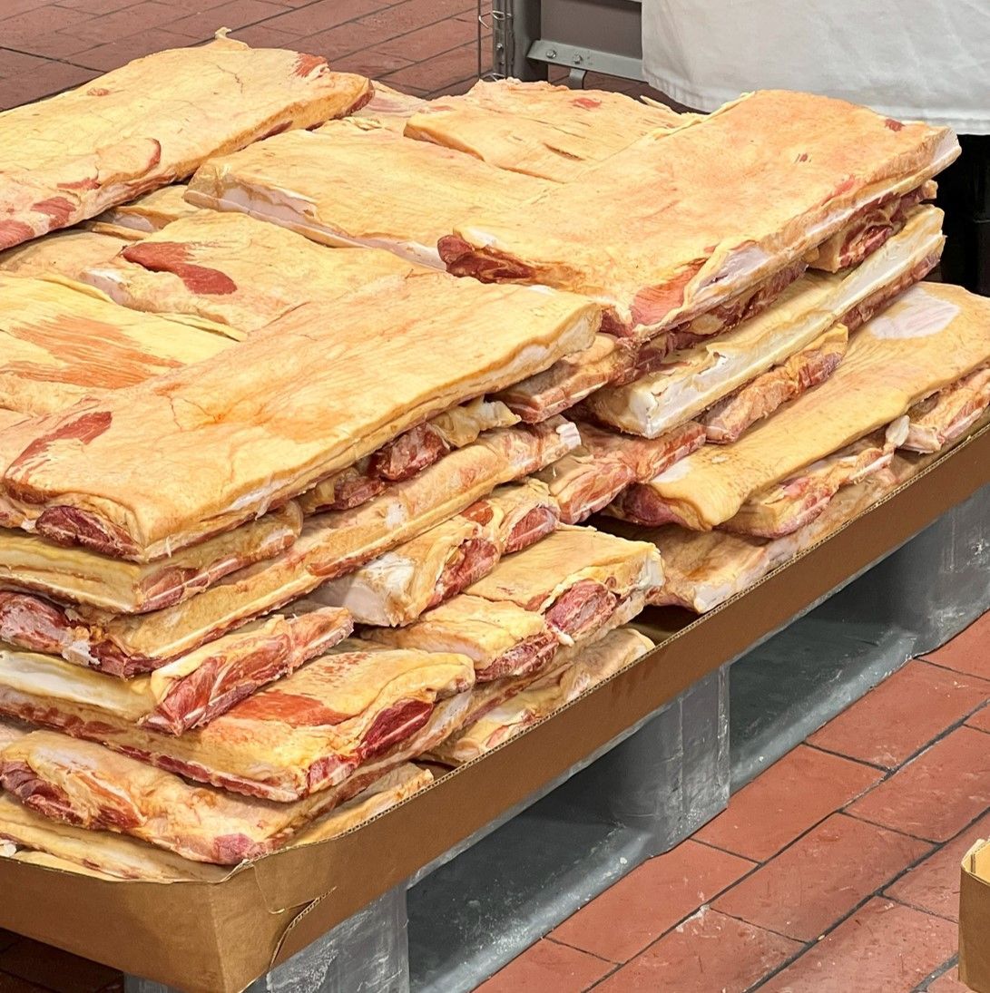 A large stack of meat is sitting on a table.