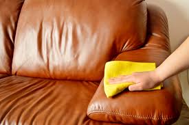 Leather couch being cleaned