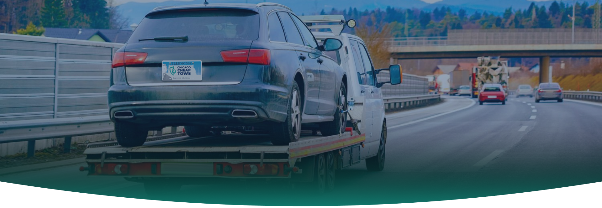 A black tow truck speeding down the road, motion blur effect | Chicago Cheap Tows