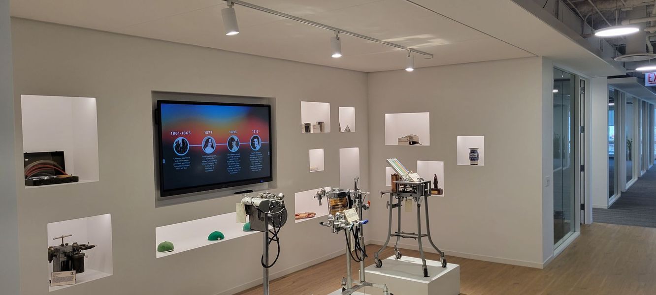 A room with a large flat screen tv on the wall.