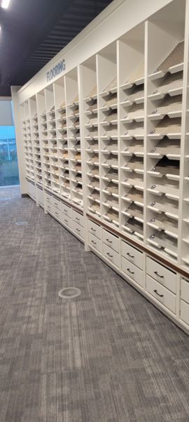 There are a lot of shelves and drawers in this room.