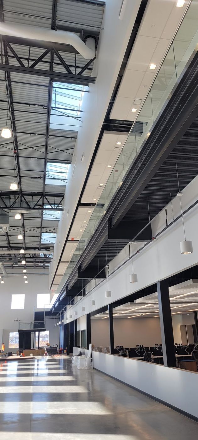 A large building with a lot of windows and a ceiling that is very high.