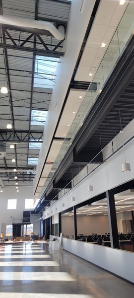 A large building with a lot of windows and a ceiling that is very high.