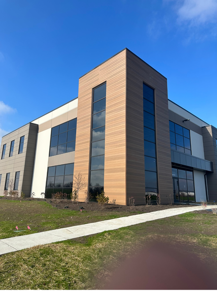 A large building with a lot of windows on a sunny day