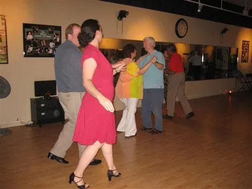 Man And A Woman Holding Hands — New Castle, DE — The Ballroom By Bill Team