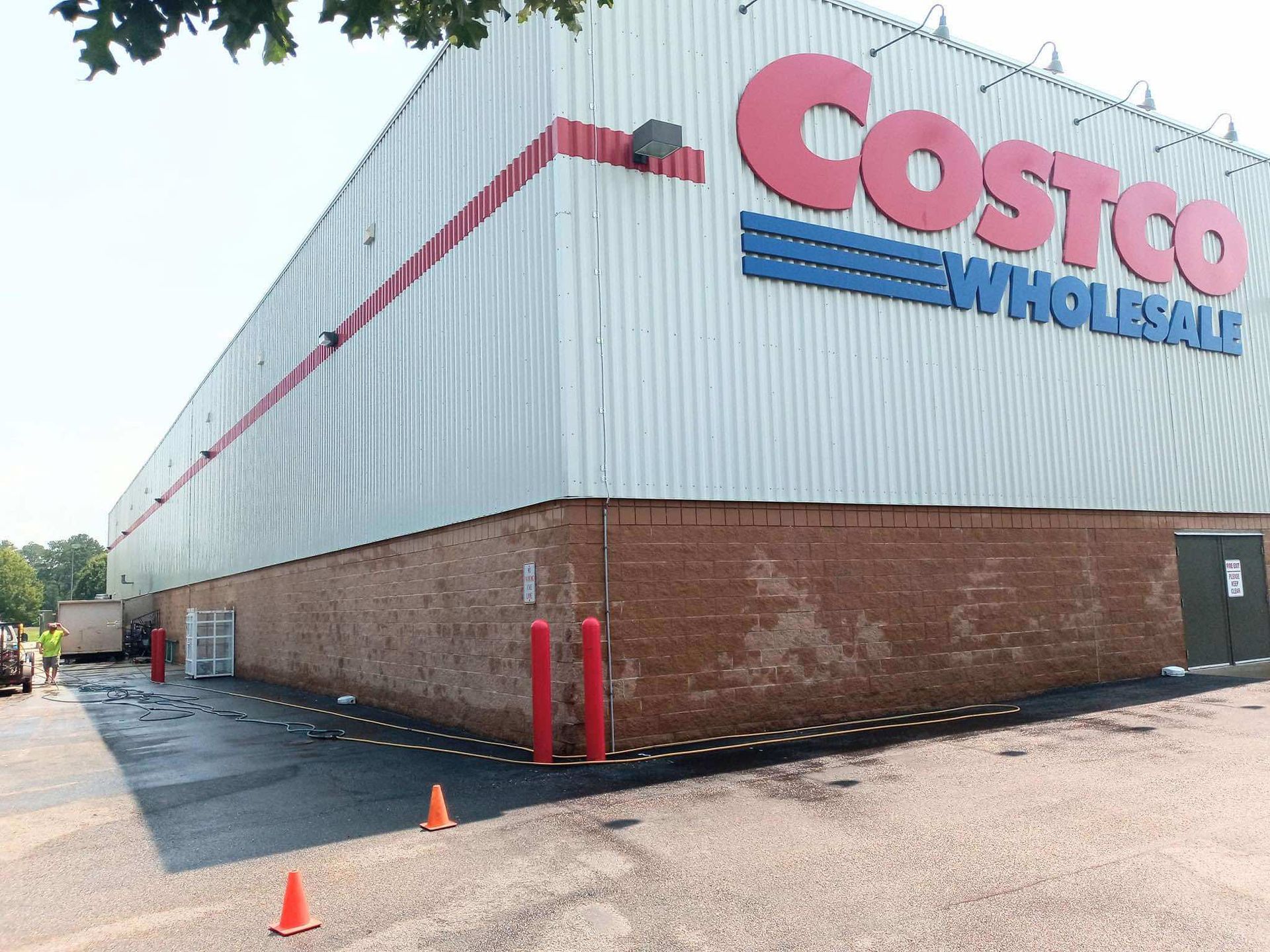 A costco wholesale store with a lot of cones in front of it