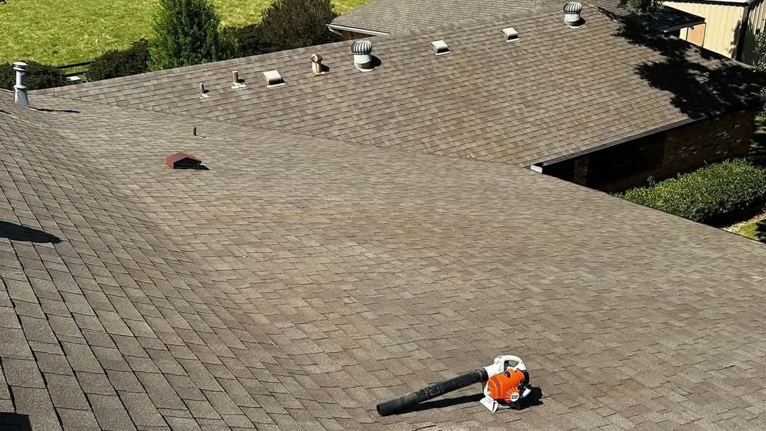 A roof with a blower on top of it.