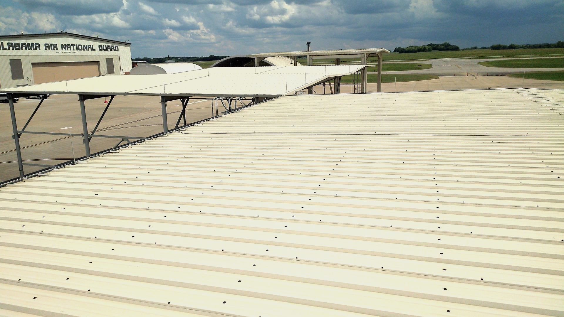 A white roof with a lot of holes in it