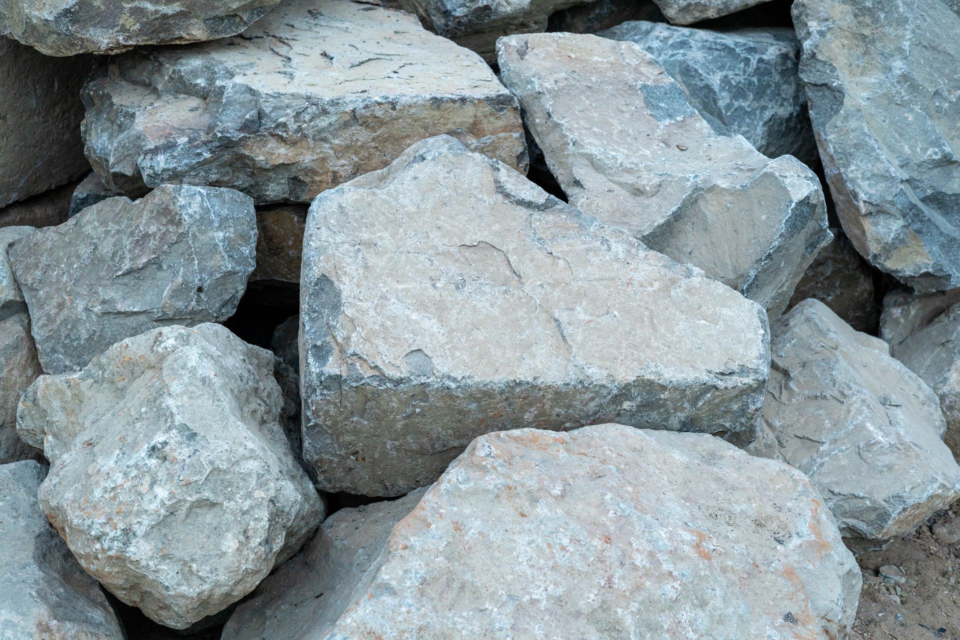 Pile of gray rocks and stones stacked together