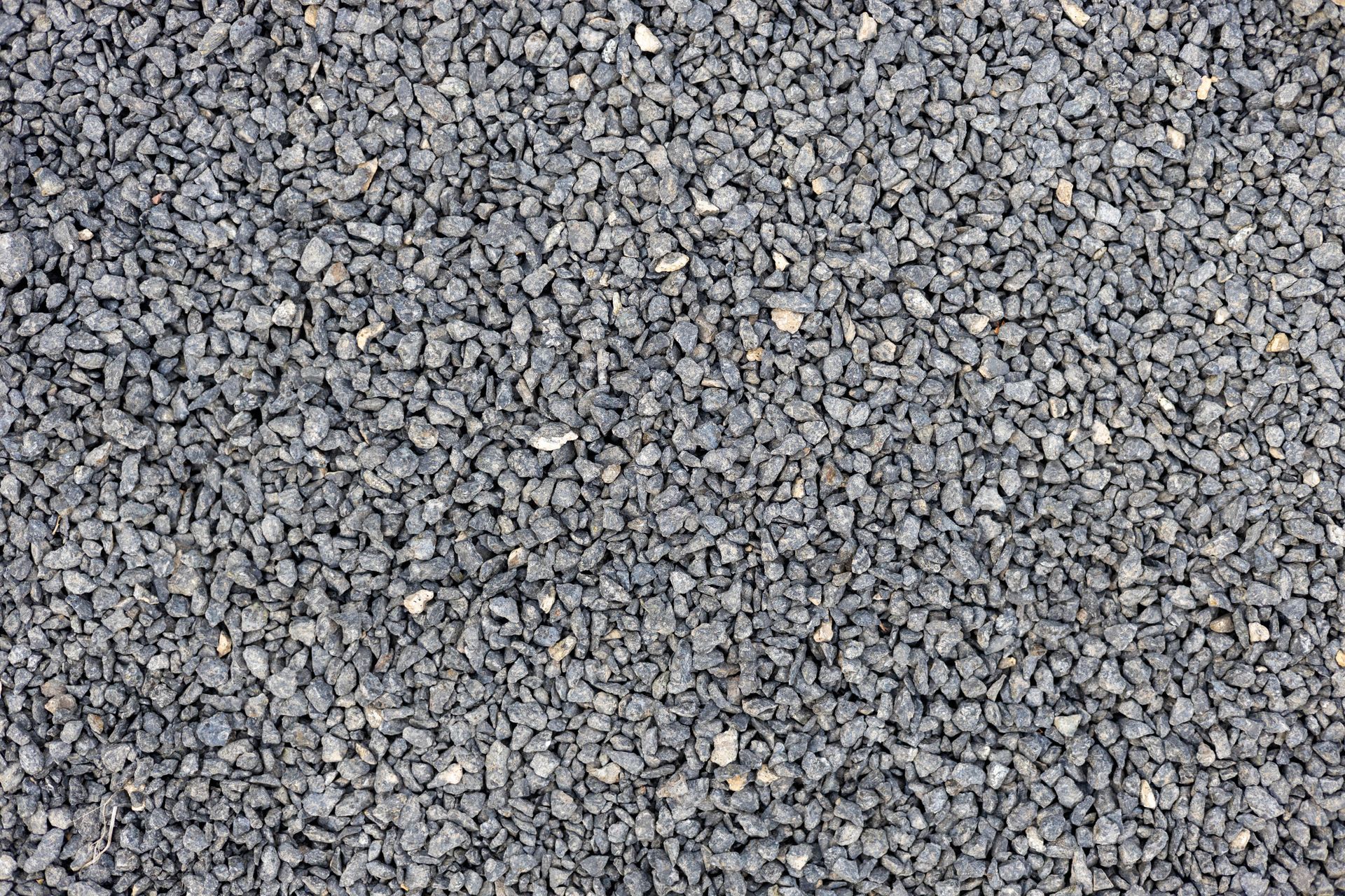 Close-up of small gray gravel stones filling the frame