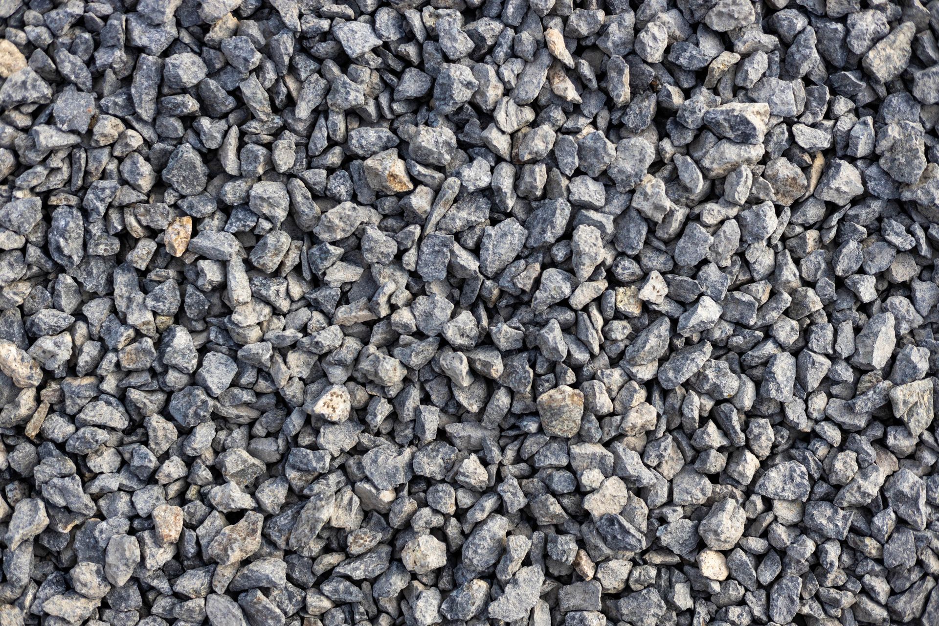 Close-up of small gray gravel stones filling the frame