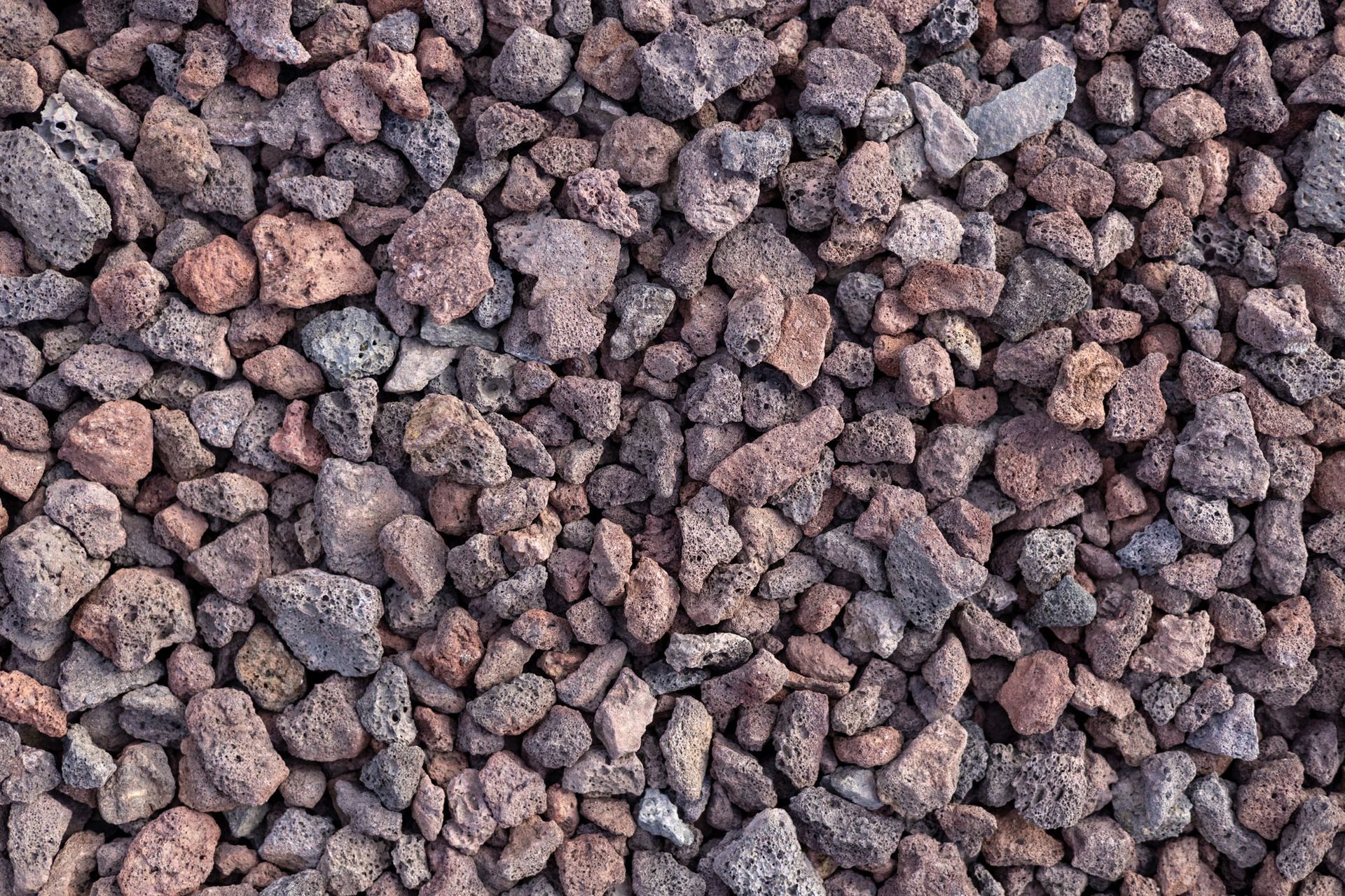 Close-up of small reddish-brown gravel stones filling the frame