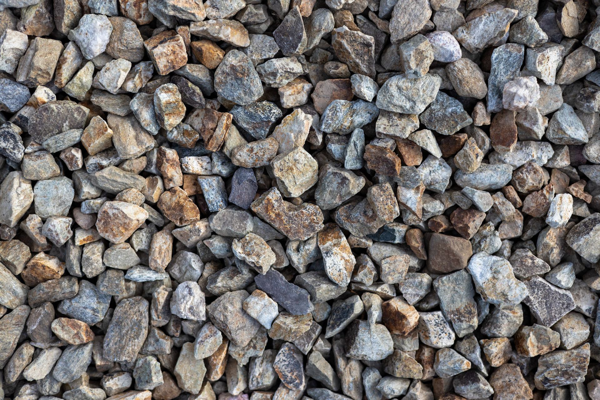 Close-up of assorted gray, brown, and tan gravel stones