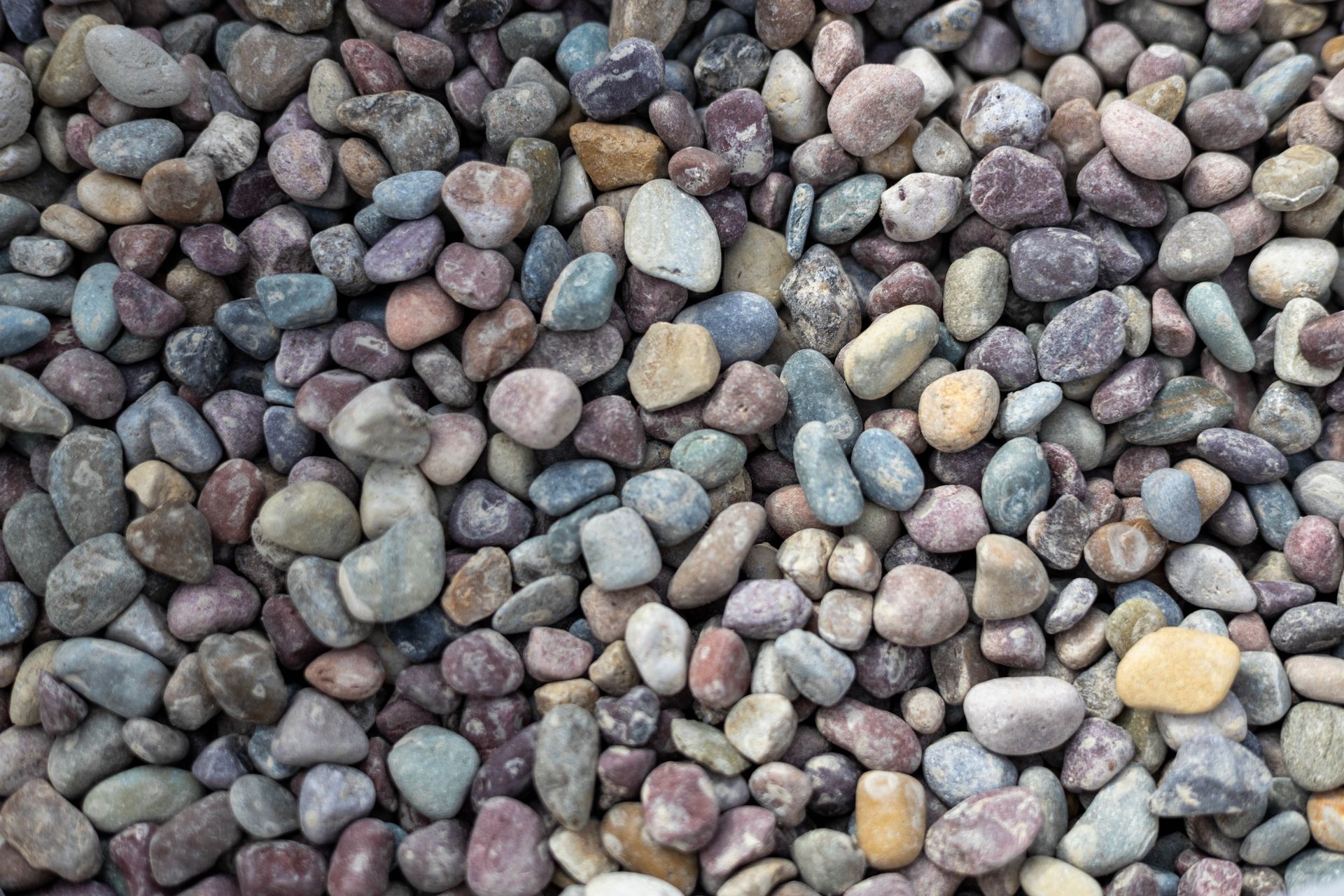 Close-up of multicolored pebbles and small stones covering the ground
