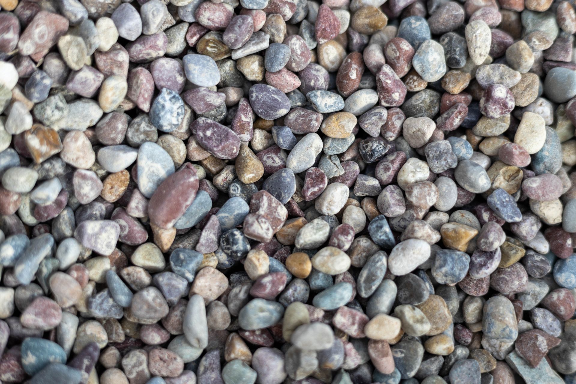 Close-up of multicolored pebbles and small stones covering the ground
