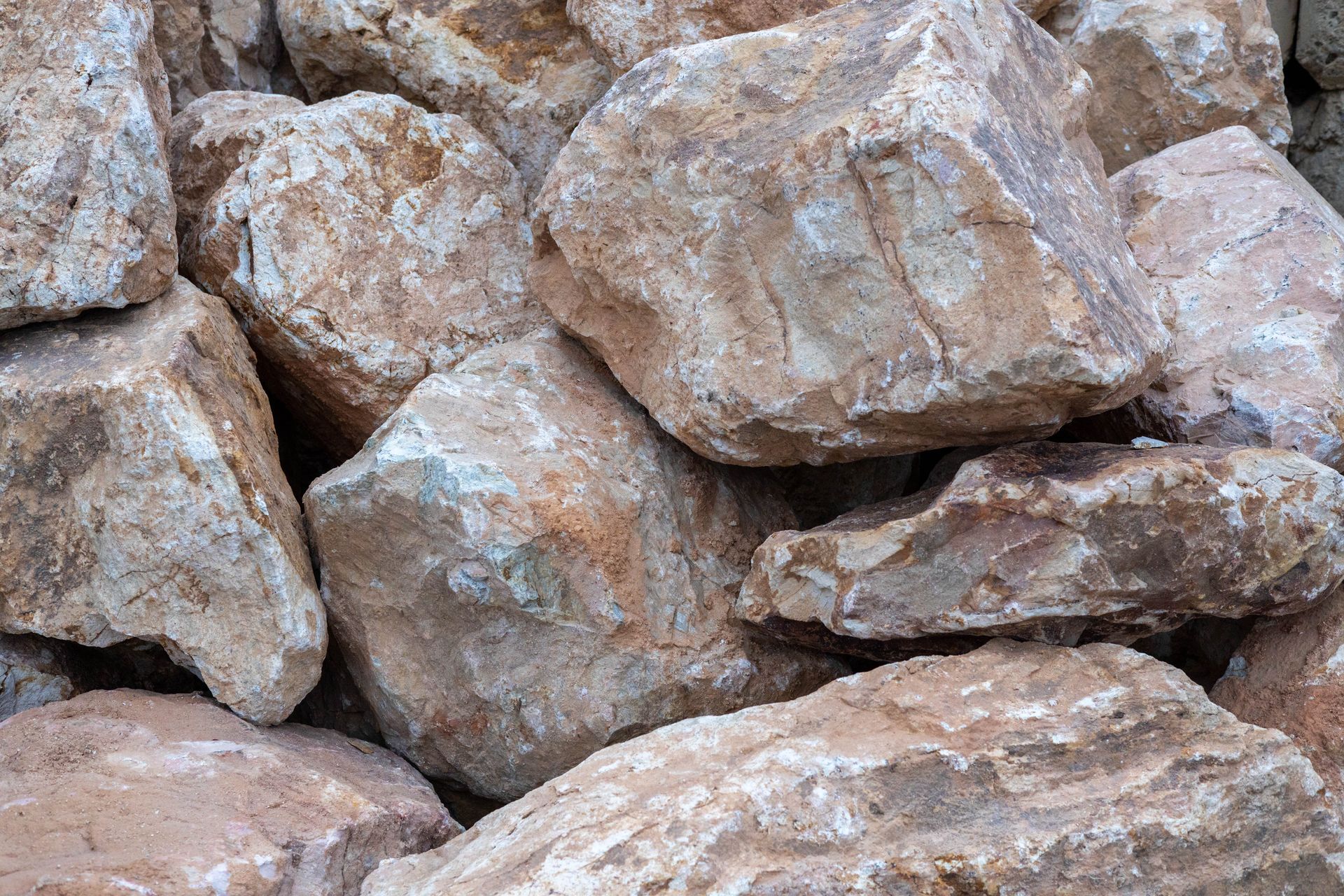 Close-up of large beige and gray rocks stacked together