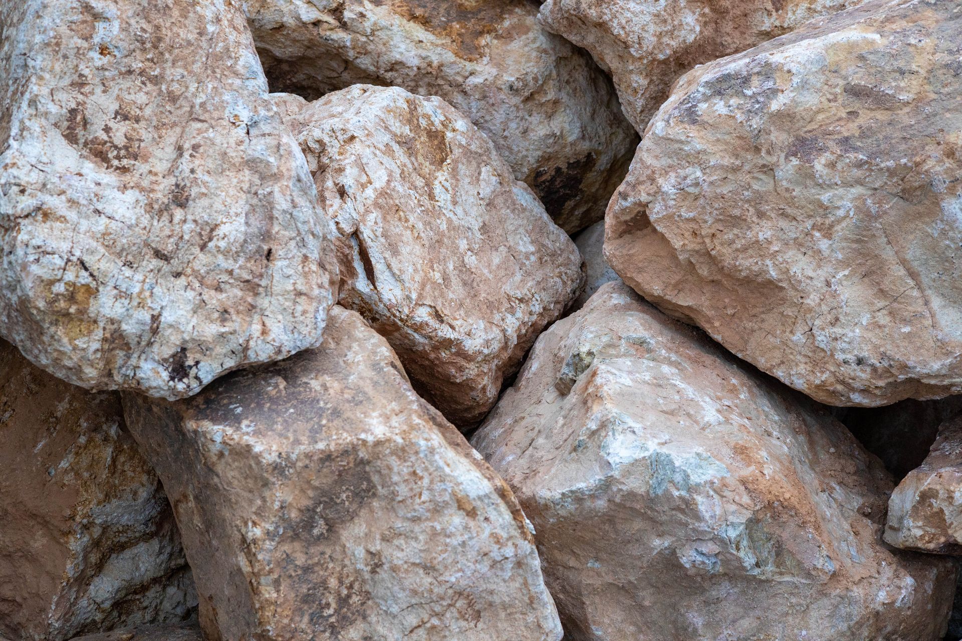 Close-up of large beige and gray rocks stacked together